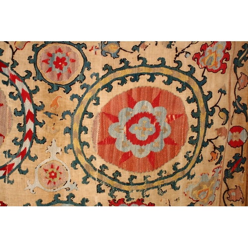 755 - AN EARLY SUZANI TEXTILE consisting of five stitched panels embroidered with palmettes and stylised f... 