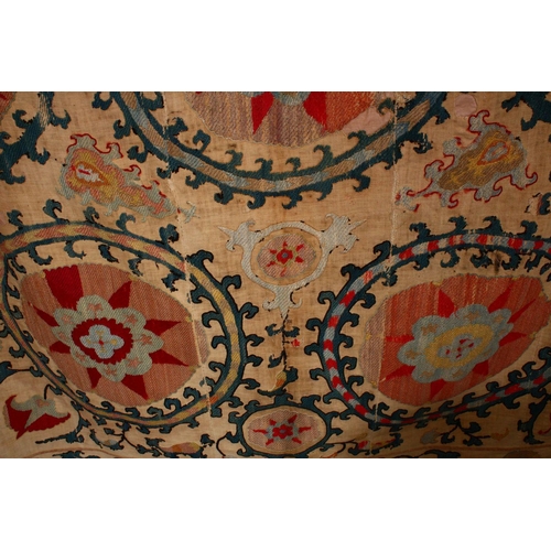 755 - AN EARLY SUZANI TEXTILE consisting of five stitched panels embroidered with palmettes and stylised f... 