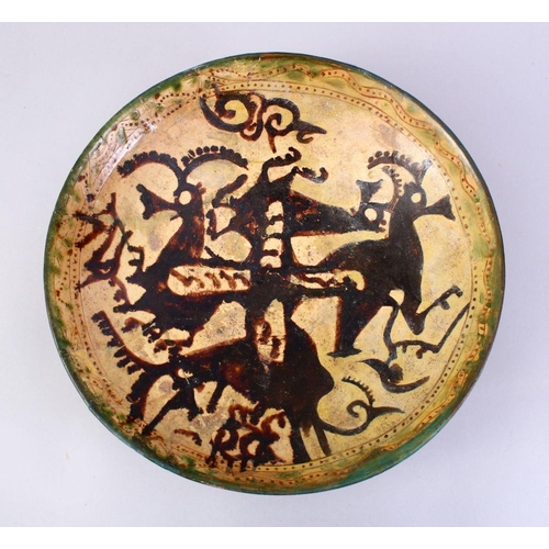 759 - A GOOD EARLY ISLAMIC POTTERY DISH, decorated with animals (AF), 33cm,