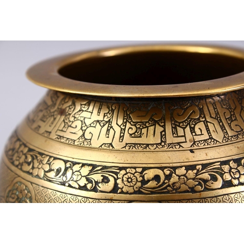 761 - A GOOD ISLAMIC BRASS TRIPLE FOOT CALLIGRAPHIC BOWL, with panels of figures and bands of calligraphy,... 