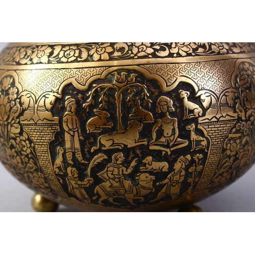 761 - A GOOD ISLAMIC BRASS TRIPLE FOOT CALLIGRAPHIC BOWL, with panels of figures and bands of calligraphy,... 