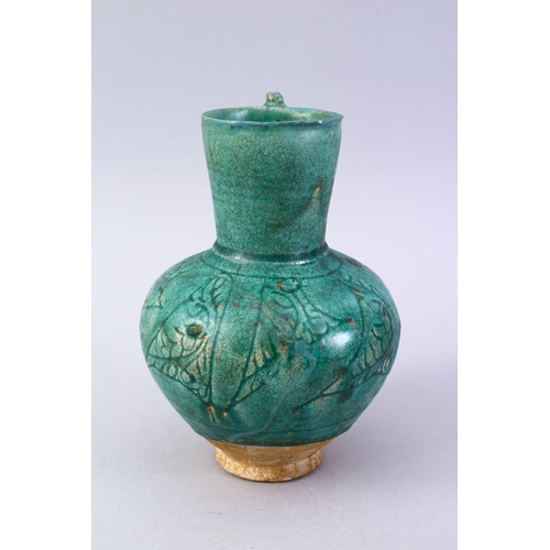 762 - A GOOD EARLY ISLAMIC TURQUOISE GLAZED POTTERY JUG, 22cm high.