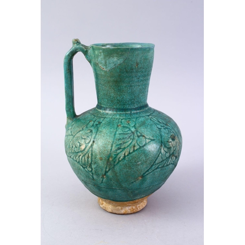 762 - A GOOD EARLY ISLAMIC TURQUOISE GLAZED POTTERY JUG, 22cm high.