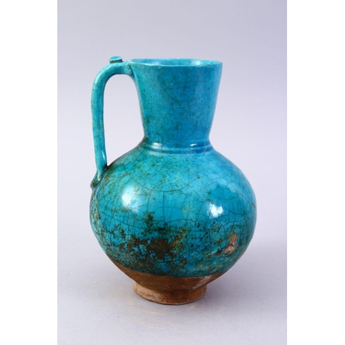 764 - A GOOD EARLY TURQUOISE GLAZED POTTERY EWER, 20cm high.