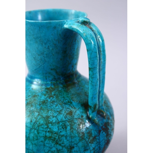 764 - A GOOD EARLY TURQUOISE GLAZED POTTERY EWER, 20cm high.