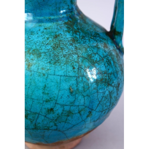 764 - A GOOD EARLY TURQUOISE GLAZED POTTERY EWER, 20cm high.