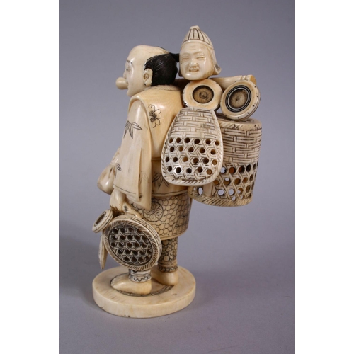 77 - A JAPANESE MEIJI PERIOD CARVED IVORY FIGURE OF A BASKET SELLER, the man stood holding his baskets ha... 