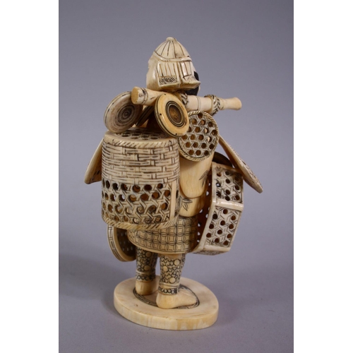 77 - A JAPANESE MEIJI PERIOD CARVED IVORY FIGURE OF A BASKET SELLER, the man stood holding his baskets ha... 