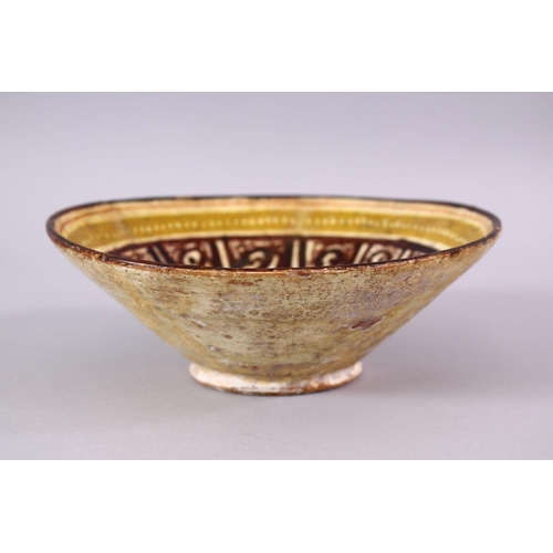 773 - A 12TH CENTURY ISLAMIC / PERSIAN POTTERY BOWL, with brown decorated panels, upon biscuit colour glaz... 