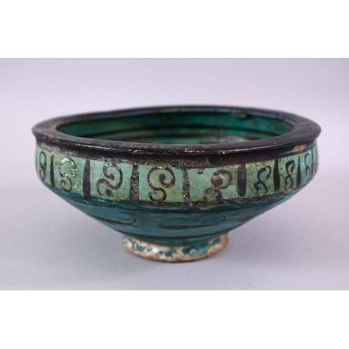 774 - AN EARLY PERSIAN TURQUOISE POTTERY BOWL, decorated with floral motif, 19cm (af)