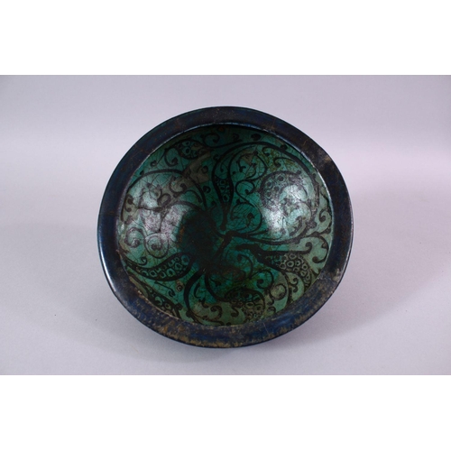 774 - AN EARLY PERSIAN TURQUOISE POTTERY BOWL, decorated with floral motif, 19cm (af)