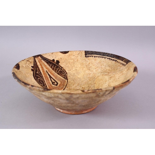 775 - AN EARLY  ISLAMIC / PERSIAN POTTERY BOWL, decorated interior with hanging motif, 23cm.