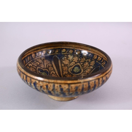 777 - AN EARLY PERSIAN SULTAN ABBAD POTTERY BOWL, with floral motif decoration, 18cm.