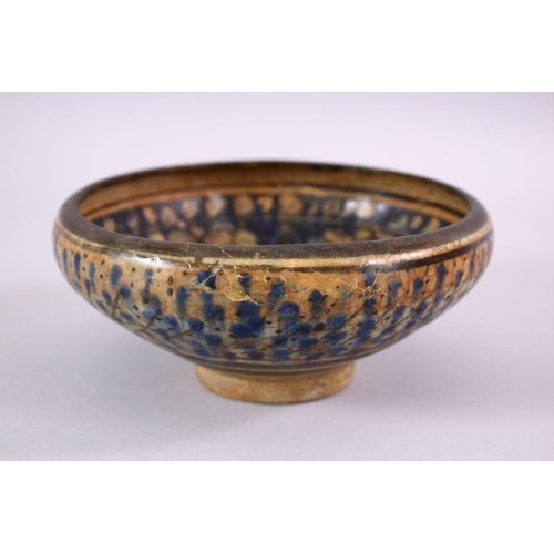 777 - AN EARLY PERSIAN SULTAN ABBAD POTTERY BOWL, with floral motif decoration, 18cm.