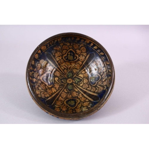 777 - AN EARLY PERSIAN SULTAN ABBAD POTTERY BOWL, with floral motif decoration, 18cm.