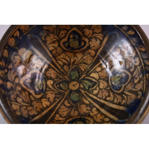 777 - AN EARLY PERSIAN SULTAN ABBAD POTTERY BOWL, with floral motif decoration, 18cm.