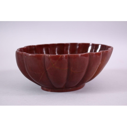 778 - A CARVED HARDSTONE / AGATE MOULDED FORM BOWL, 20cm