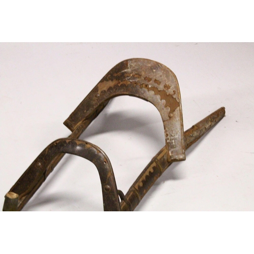 779 - A LARGE WOOD & METAL POSSIBLY EGYPTIAN CAMEL SADDLE / SEAT, the timbers enclosed and decorated with ... 