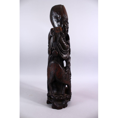 78 - A LARGE 19TH / 20TH CENTURY CHINESE HARDWOOD & SILVER INLAID FIGURE OF SHOU LAO, stood aside deer an... 