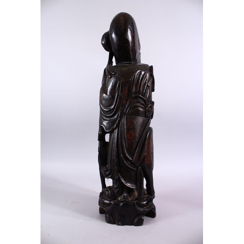 78 - A LARGE 19TH / 20TH CENTURY CHINESE HARDWOOD & SILVER INLAID FIGURE OF SHOU LAO, stood aside deer an... 