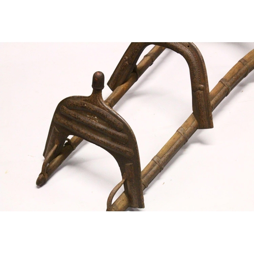 780 - A LARGE WOOD & METAL POSSIBLY EGYPTIAN CAMEL SADDLE / SEAT, the timbers enclosed and decorated with ... 