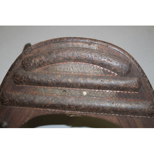 780 - A LARGE WOOD & METAL POSSIBLY EGYPTIAN CAMEL SADDLE / SEAT, the timbers enclosed and decorated with ... 