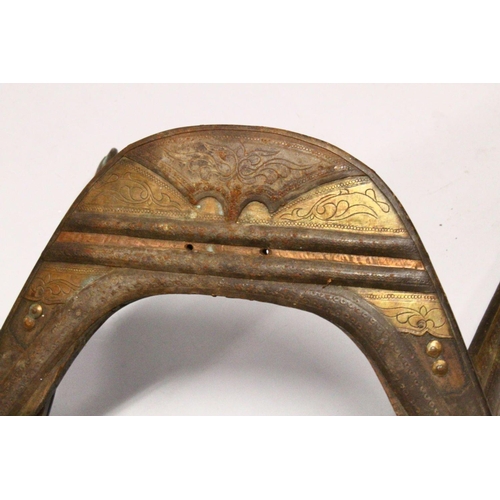 781 - A LARGE WOOD & METAL POSSIBLY EGYPTIAN CAMEL SADDLE / SEAT, the timbers enclosed and decorated with ... 