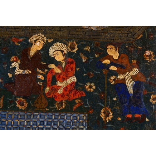 783 - A 18TH / 19TH CENTURY PERSIAN PAPIER MACHE PAINTED PANEL, depicting figures in garden settings, 37cm... 