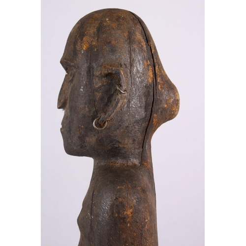 785 - AN AFRICAN CARVED WOODEN NATIVE FIGURE, with piercing's, 80cm.