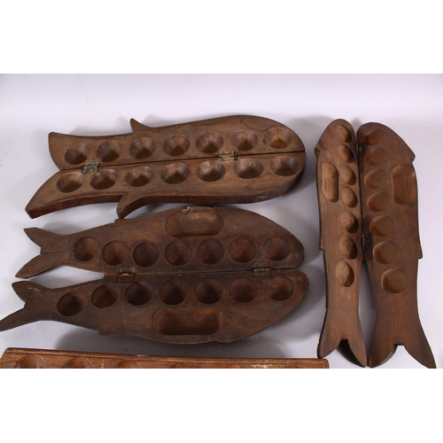 786 - FOUR INDIAN CARVED WOODEN FISH FORMED SPICE BOXES - one of rectangular form, 46cm, 50cm, 44cm, the r... 