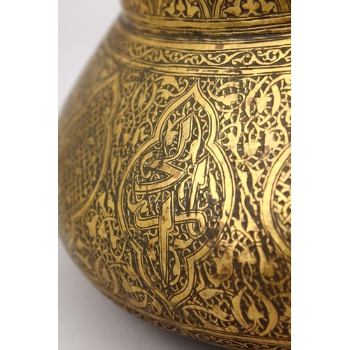 794 - A GOOD 19TH CENTURY DAMASCUS BRASS CARVED BOWL, the bowl carved with formal floral motif, 25cm.