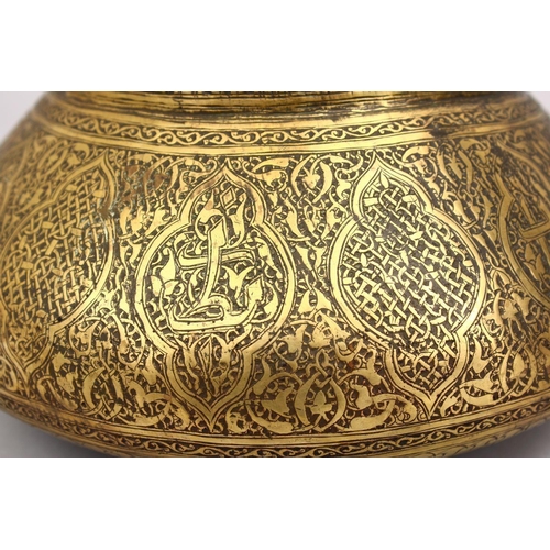 794 - A GOOD 19TH CENTURY DAMASCUS BRASS CARVED BOWL, the bowl carved with formal floral motif, 25cm.