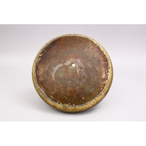 794 - A GOOD 19TH CENTURY DAMASCUS BRASS CARVED BOWL, the bowl carved with formal floral motif, 25cm.