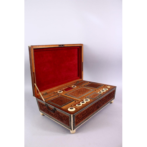 797 - A 19TH CENTURY ANGLO INDIAN INLAID LIDDED SEWING BOX, with carved wood depicting figures and animals... 