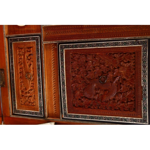 797 - A 19TH CENTURY ANGLO INDIAN INLAID LIDDED SEWING BOX, with carved wood depicting figures and animals... 