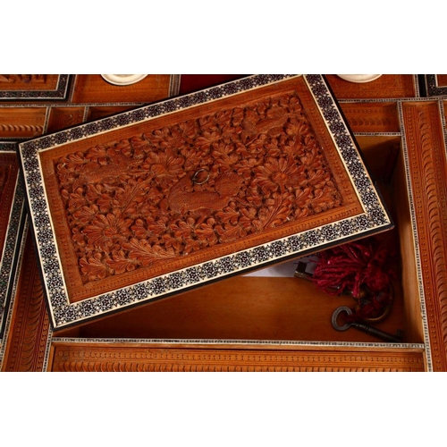 797 - A 19TH CENTURY ANGLO INDIAN INLAID LIDDED SEWING BOX, with carved wood depicting figures and animals... 