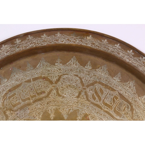 801 - A LARGE BRASS JEWISH CALLIGRAPHIC CHARGER, carved with hebrew script in panels, 55cm.