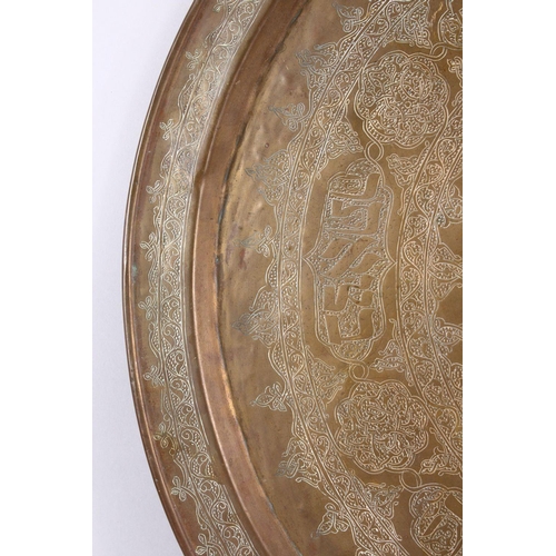 801 - A LARGE BRASS JEWISH CALLIGRAPHIC CHARGER, carved with hebrew script in panels, 55cm.