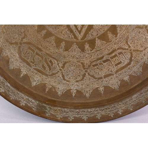 801 - A LARGE BRASS JEWISH CALLIGRAPHIC CHARGER, carved with hebrew script in panels, 55cm.