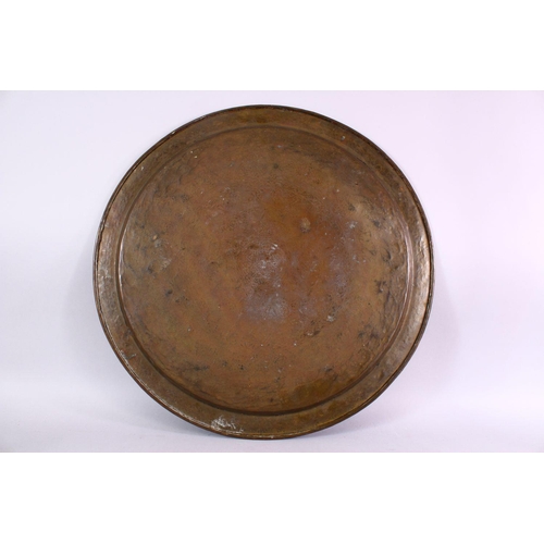 801 - A LARGE BRASS JEWISH CALLIGRAPHIC CHARGER, carved with hebrew script in panels, 55cm.