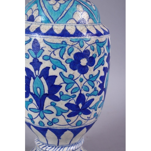 815 - A 19TH CENTURY ISLAMIC BLUE, TURQUOISE AND WHITE POTTERY MULTAN VASE, decorated with blue formal scr... 