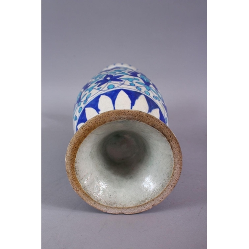 815 - A 19TH CENTURY ISLAMIC BLUE, TURQUOISE AND WHITE POTTERY MULTAN VASE, decorated with blue formal scr... 