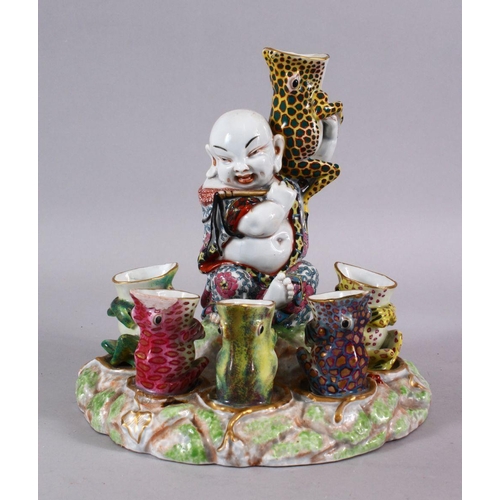 83 - A CHINESE REPUBLIC STYLE PORCELAIN FLOWER / EGG HOLDER OF BUDDHA AND FROGS, the frogs seated with th... 