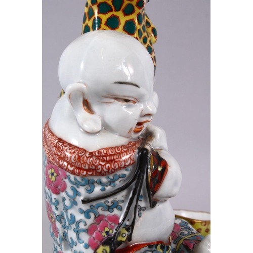 83 - A CHINESE REPUBLIC STYLE PORCELAIN FLOWER / EGG HOLDER OF BUDDHA AND FROGS, the frogs seated with th... 