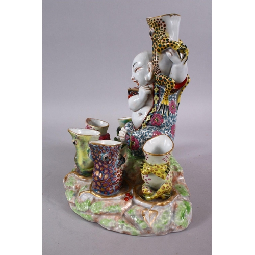 83 - A CHINESE REPUBLIC STYLE PORCELAIN FLOWER / EGG HOLDER OF BUDDHA AND FROGS, the frogs seated with th... 