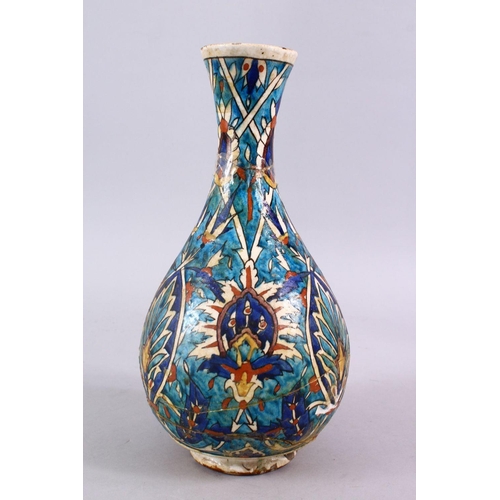 836 - AN EARLY PERSIAN POTTERY BOTTLE VASE, with formal floral motif, 30cm, (AF)