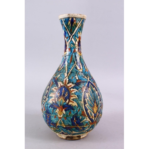 836 - AN EARLY PERSIAN POTTERY BOTTLE VASE, with formal floral motif, 30cm, (AF)