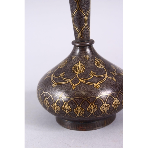 838 - AN 18TH / 19TH CENTURY ISLAMIC GOLD INLAID STEEL VASE, the gold inlay with formal decoration, 13cm.