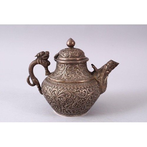 839 - A GOOD 19TH CENTURY TURKISH SOLID SILVER TEAPOT  carved with formal foliage and a dog style handle, ... 