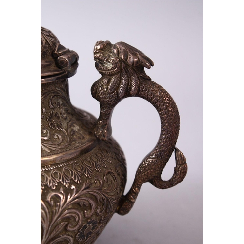 839 - A GOOD 19TH CENTURY TURKISH SOLID SILVER TEAPOT  carved with formal foliage and a dog style handle, ... 